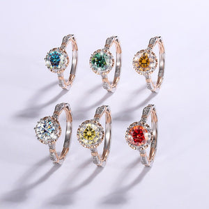 Set of six earrings with colorful gemstones on a light gray background