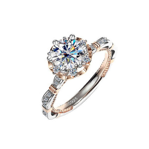 A collection of six moissanite cocktail rings with floral designs, displayed against a white background. The rings feature a variety of colors including blue, yellow, and red, with a hypoallergenic silver finish.