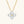 Gold necklace with a four-crystal pendant on a white background