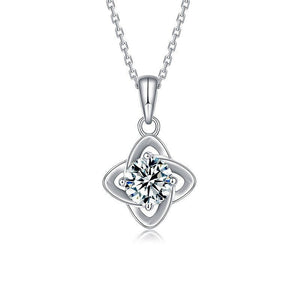 Silver necklace with a heart-shaped pendant on a white background