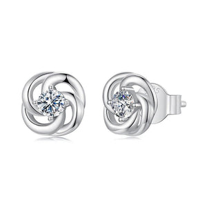 Silver earrings with a diamond design on a white background