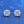Pair of diamond earrings on a blue background