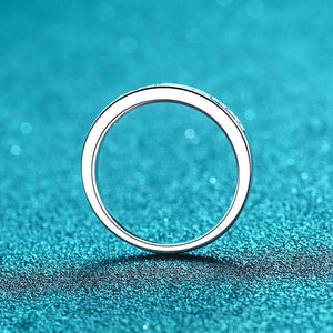 Silver ring on a textured blue background