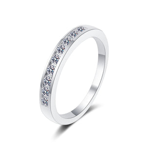 Silver ring with small diamonds on a white background