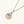 Gold necklace with a diamond pendant on a white background