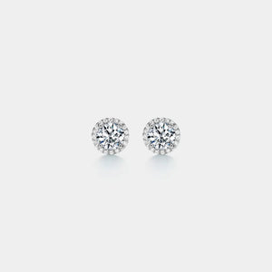 Pair of diamond stud earrings on a light gray background