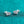 Pair of diamond stud earrings on a teal glittery background