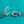 Silver hoop earrings on a teal glittery background