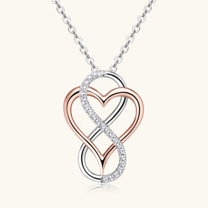 Heart and infinity symbol pendant on a chain against a white background