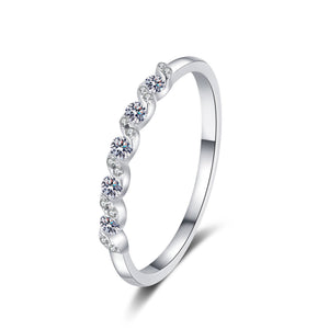 Silver ring with small diamonds on a white background