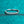 Silver ring with small diamonds on a teal glittery background