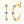 Gold hoop earrings with clear gemstones on a white background