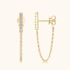 Gold chain earring with clear gemstones on a white background