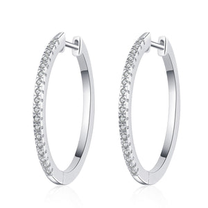 Pair of silver hoop earrings with small diamonds on a white background