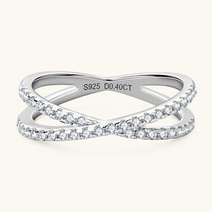 Silver ring with diamond accents on a white background