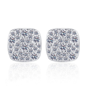 Square-shaped earrings with sparkling stones on a white background