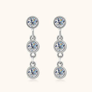 Silver earrings with multiple gemstones on a white background