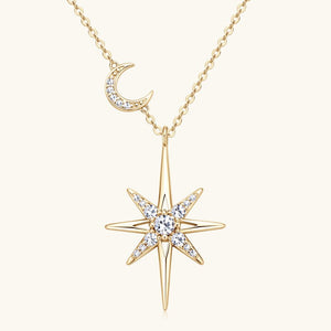 Gold necklace with star and moon pendant on a white background