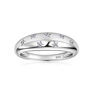 Silver star ring with small diamonds on a white background