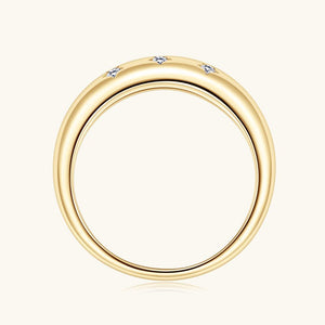Gold star ring with small diamonds on a white background