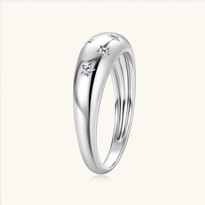 Silver star ring with small diamonds on a white background