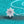 Diamond necklace on a teal glittery background