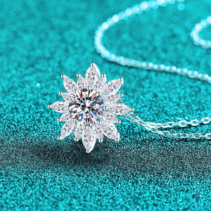 Diamond necklace on a teal glittery background