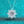 Silver necklace with a star-shaped diamond pendant on a turquoise background