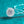 Silver necklace with a snowflake-shaped pendant on a teal background