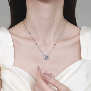 Necklace with a floral pendant on a model against a neutral background