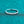 Silver ring with small moissanite on a teal textured background
