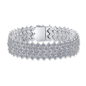 Silver bracelet with intricate design on a white background