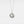 Silver necklace with a round locket featuring a moon face and star on a light gray background