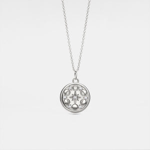 A white gold-plated custom photo locket necklace with a chain, featuring a moon phase design with a star in the center.