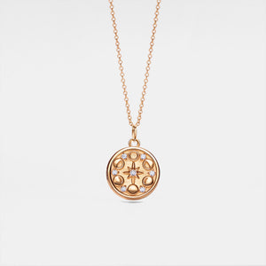 A rose gold-plated custom photo locket necklace with a chain, featuring a moon phase design with a star in the center.