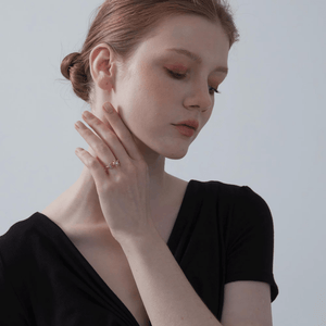 Model wearing a gold-plated sterling silver spinner ring with a crescent moon and a star design, featuring cubic zirconia.