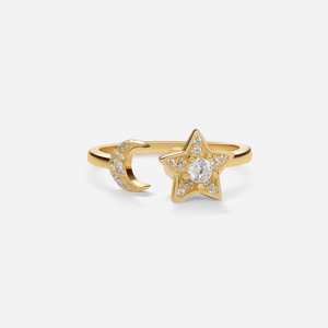 A gold-plated sterling silver spinner ring with a crescent moon and a star design, featuring cubic zirconia.