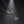 Silver necklace with a crescent moon and star pendant on a dark background
