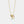 Gold necklace with interlocking rings pendant on a white background
