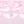 Flower-shaped silver pendant on a pink satin background