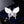 Butterfly-shaped brooch with gemstones on a dark blue velvet background