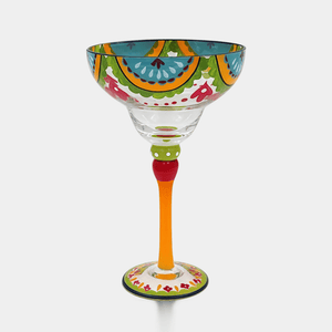 Colorful margarita glass with decorative patterns on a white background