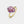 Gold ring with a purple gemstone on a light gray background