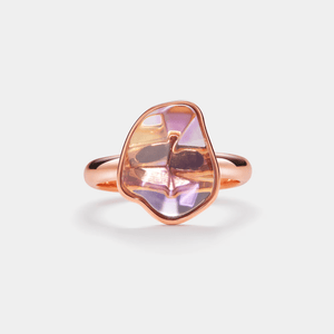 A gold-plated silver cocktail ring with a large, multifaceted pink amethyst crystal centerpiece.