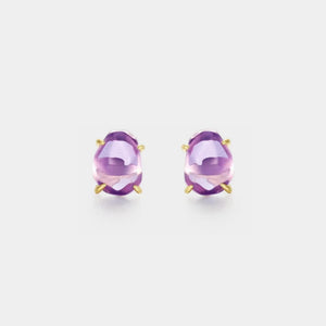Pair of purple gemstone earrings on a light gray background