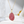 Necklace with a pink pendant on a white surface