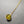 Necklace with a yellow gemstone pendant on a gray background