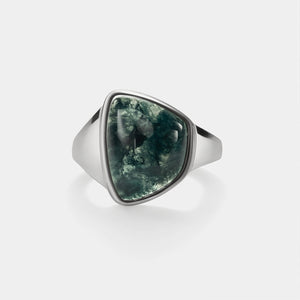 Silver ring with a green stone on a white background