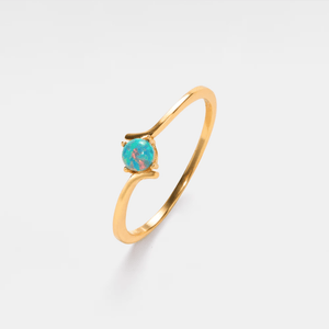 A gold-plated, solid sterling silver bypass ring with a hypoallergenic finish, featuring a natural opal stone in a thin bypass design.