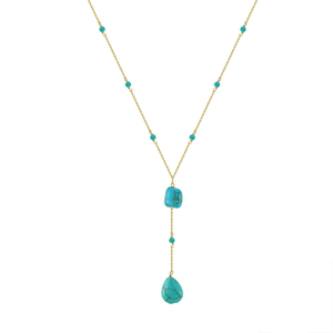 Turquoise necklace with gold chain on a white background